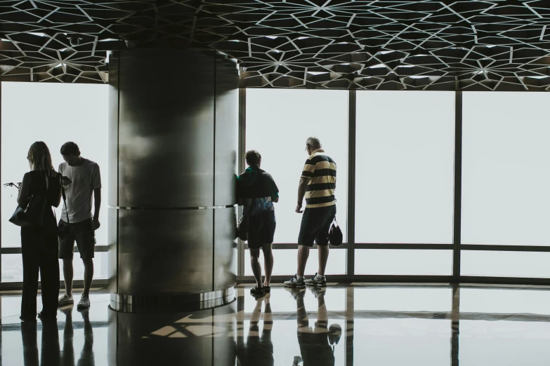 a group of people standing at the top of an observation platform