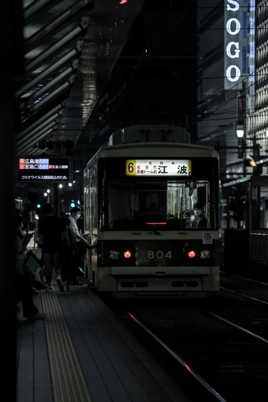 a city bus parked at the train station next to a platform