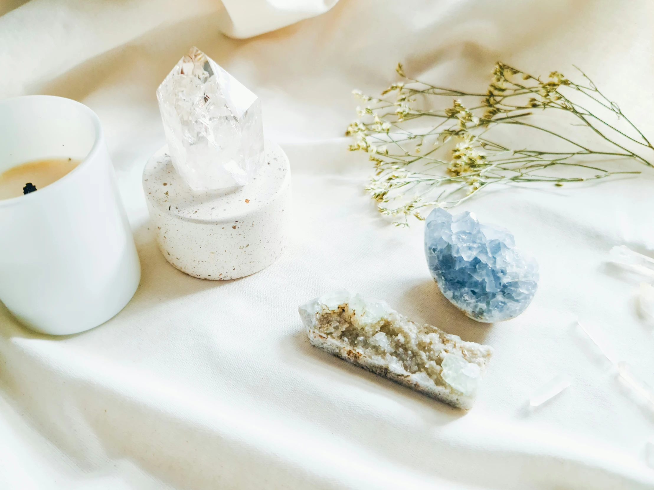 blue and white objects and a cup on a table