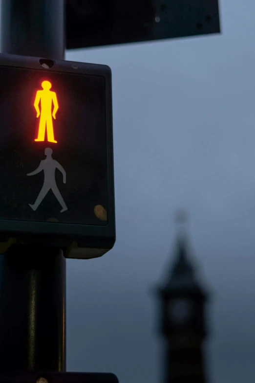 a red pedestrian walk sign sitting on the side of a traffic light