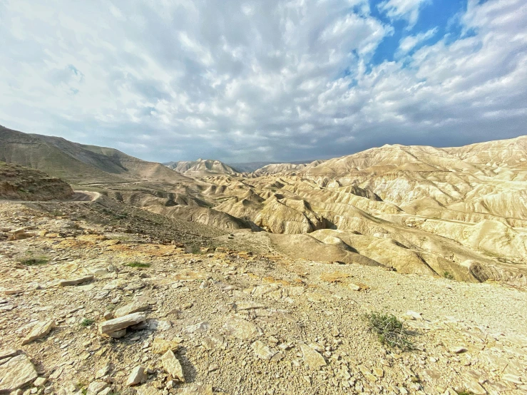 a desert landscape with mountains in the background