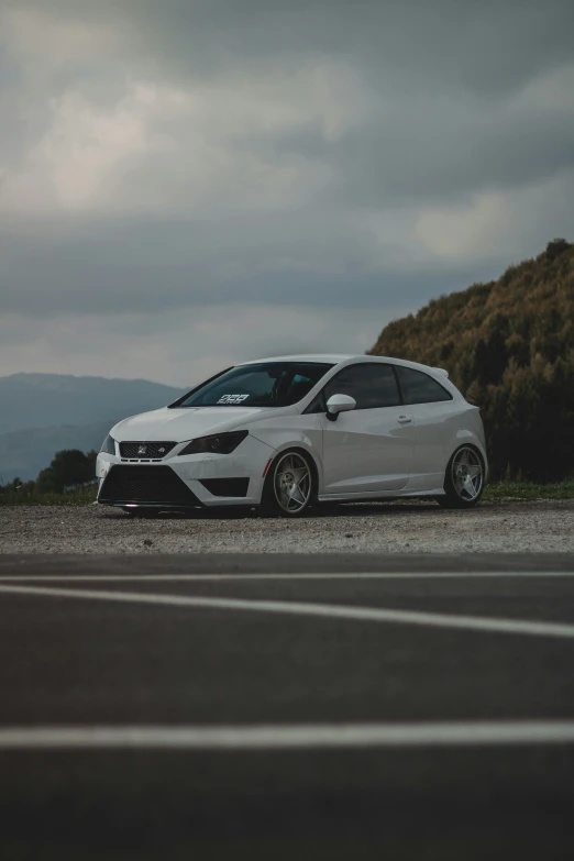 a white car parked on the side of the road