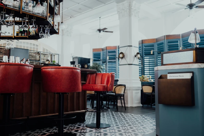 the interior of a restaurant, with red bars