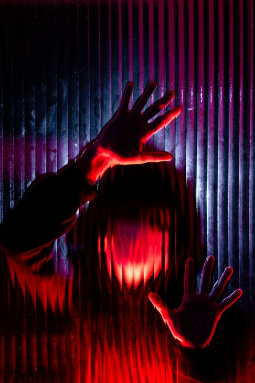 a neon image of hands with fingers in the air