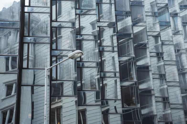 the building is covered with many windows and security lights