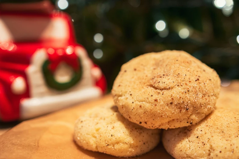 cookies stacked on top of each other with christmas lights behind them