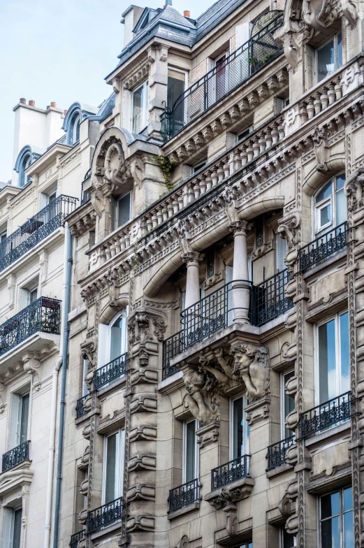 ornate stone building with balconies and balconies on the second story