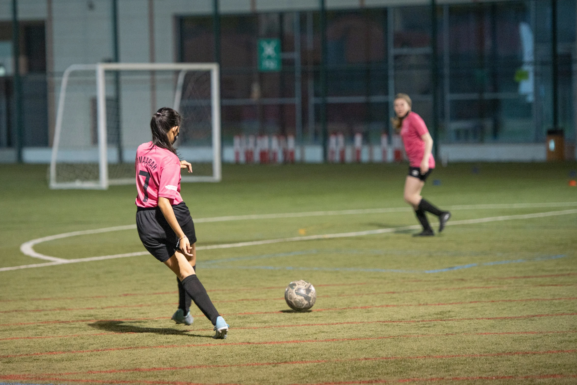 a couple of women playing a game of soccer