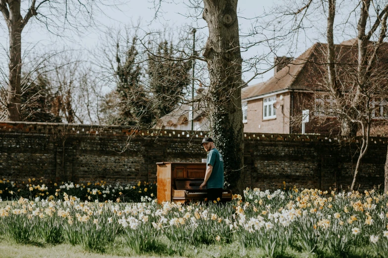 a person is standing behind a wood bench