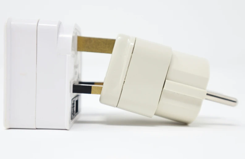 an up - close s of two power outlets on white background