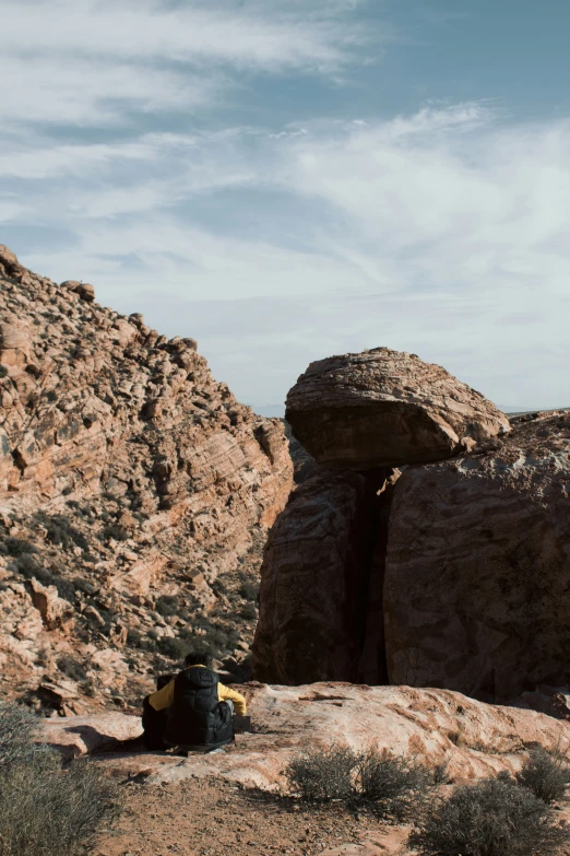 an arid desert area that has mountains in the background