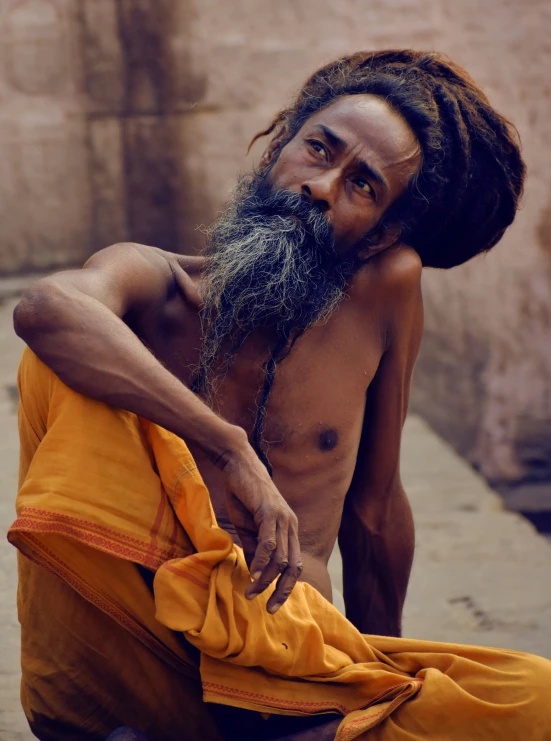 an african man with a long grey beard