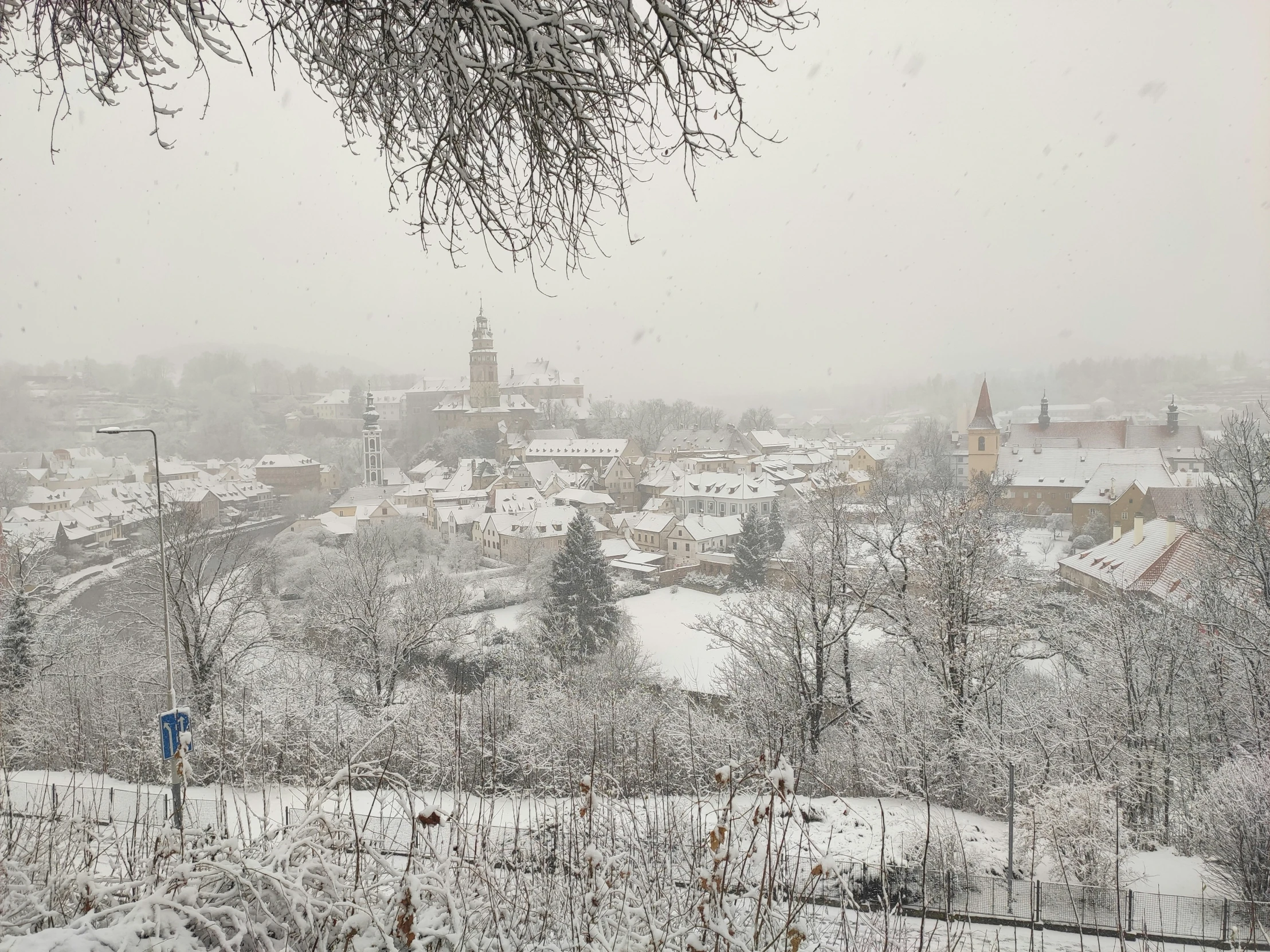 an overcast day in winter overlooking the town with a snowy background