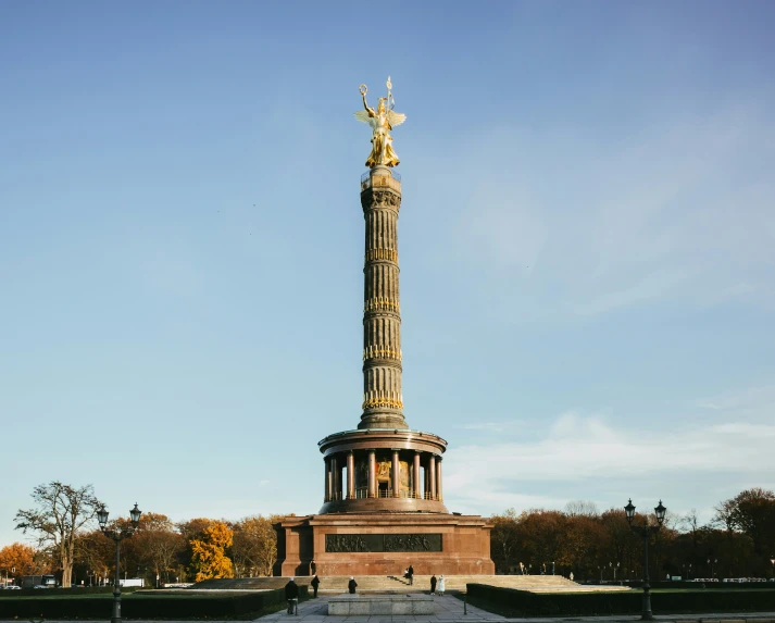 a statue on top of a stone monument