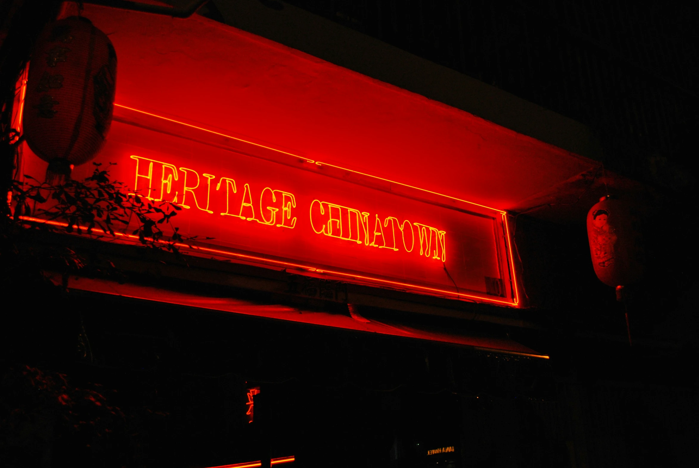 the sign is glowing red for an upcoming restaurant