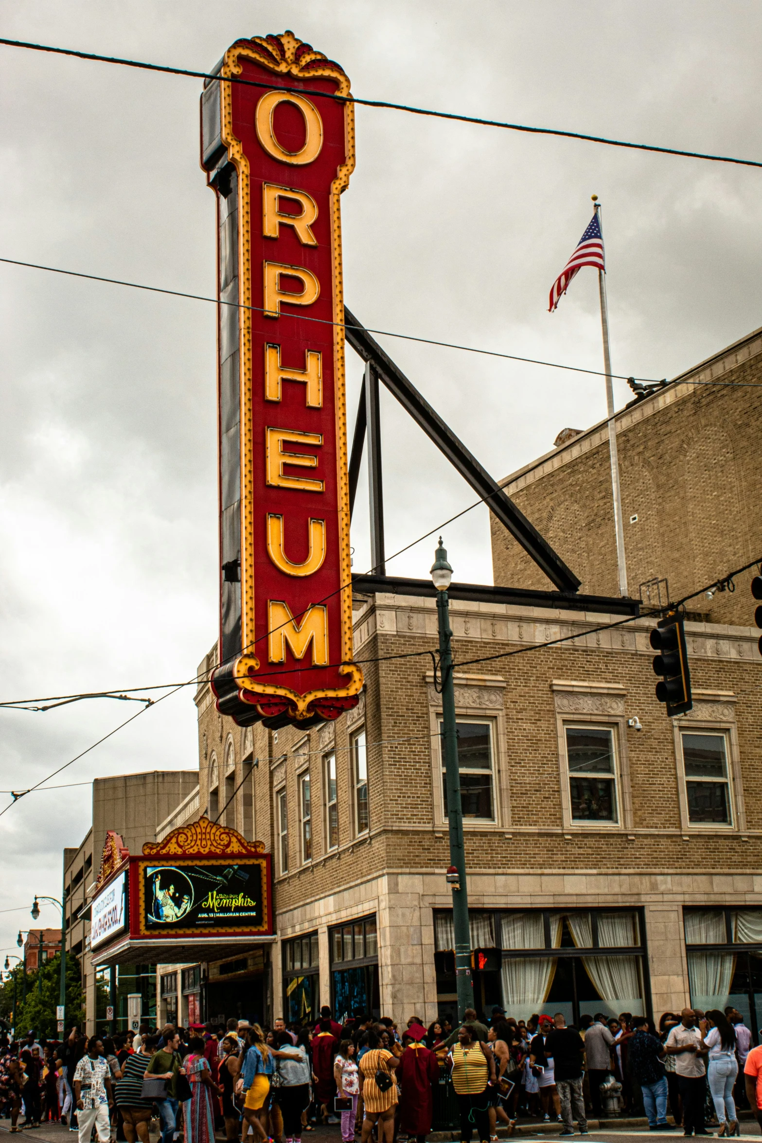 a building has a tall, red and yellow sign