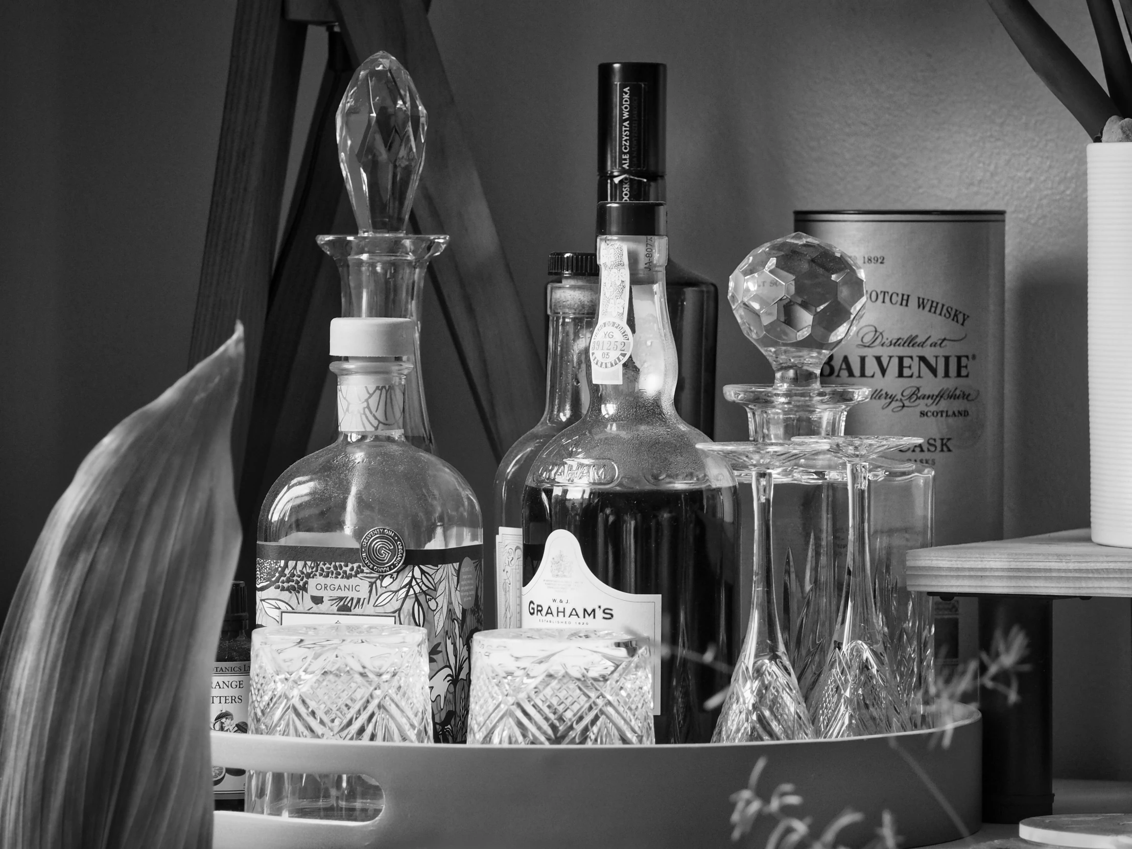 a set of bottles of alcohol sitting in a basket