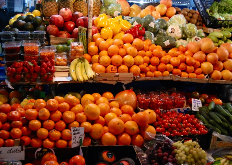 an assortment of fruits and vegetables on display at a store