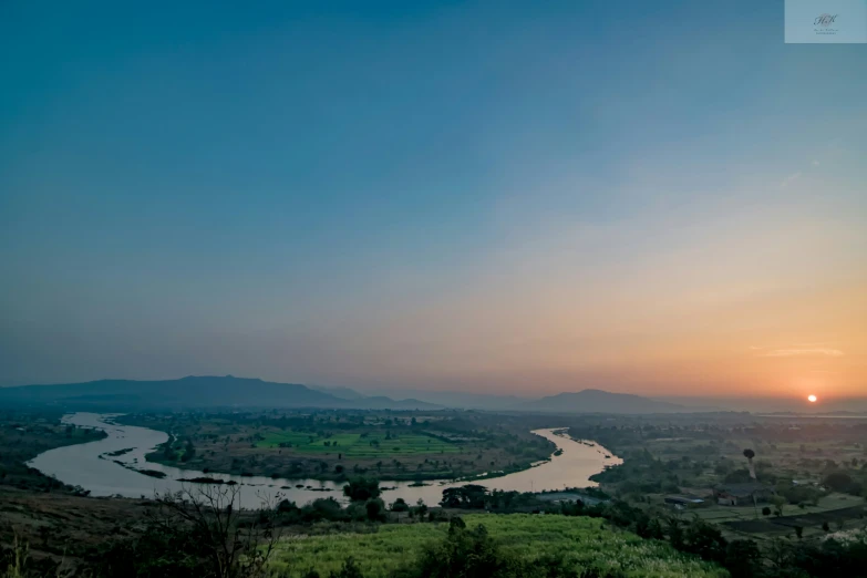 a river runs through the mountains of the country side