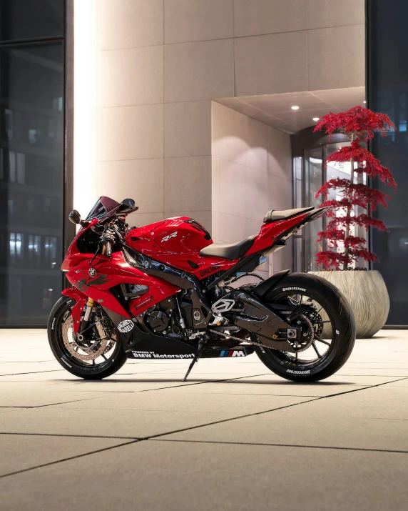 the motor cycle is parked outside a modern building