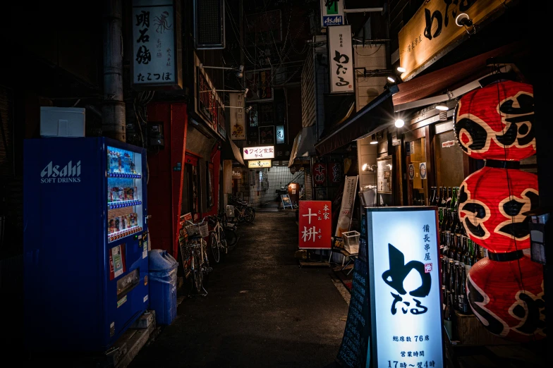 an alley way covered in signs in asian language