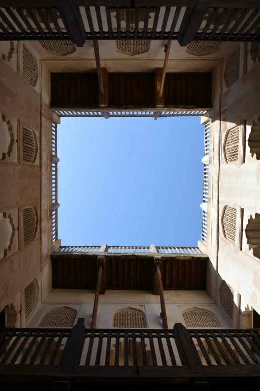 a view from below looking up into the sky through a window