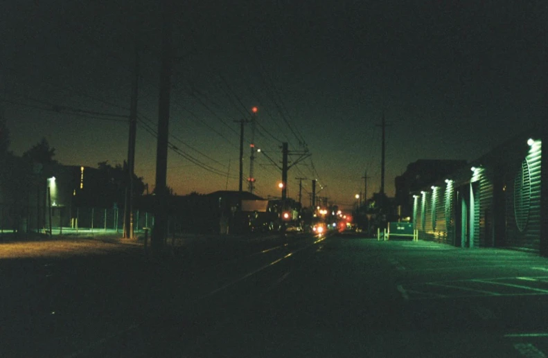 traffic is traveling down the empty street of an urban area