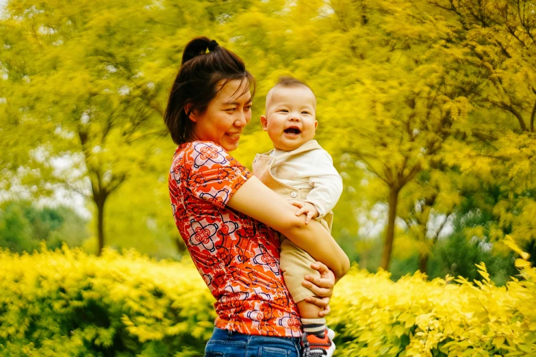 a woman holding a baby in her arms