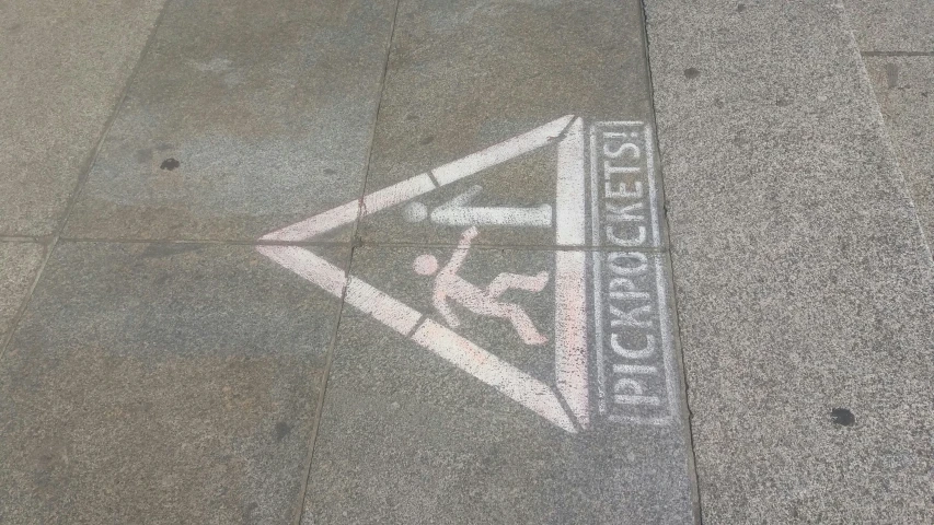 a close up of a sidewalk with the initials of different languages