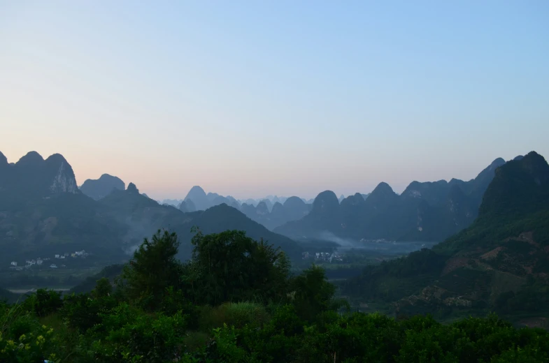 the mountains are shown with some small houses on them