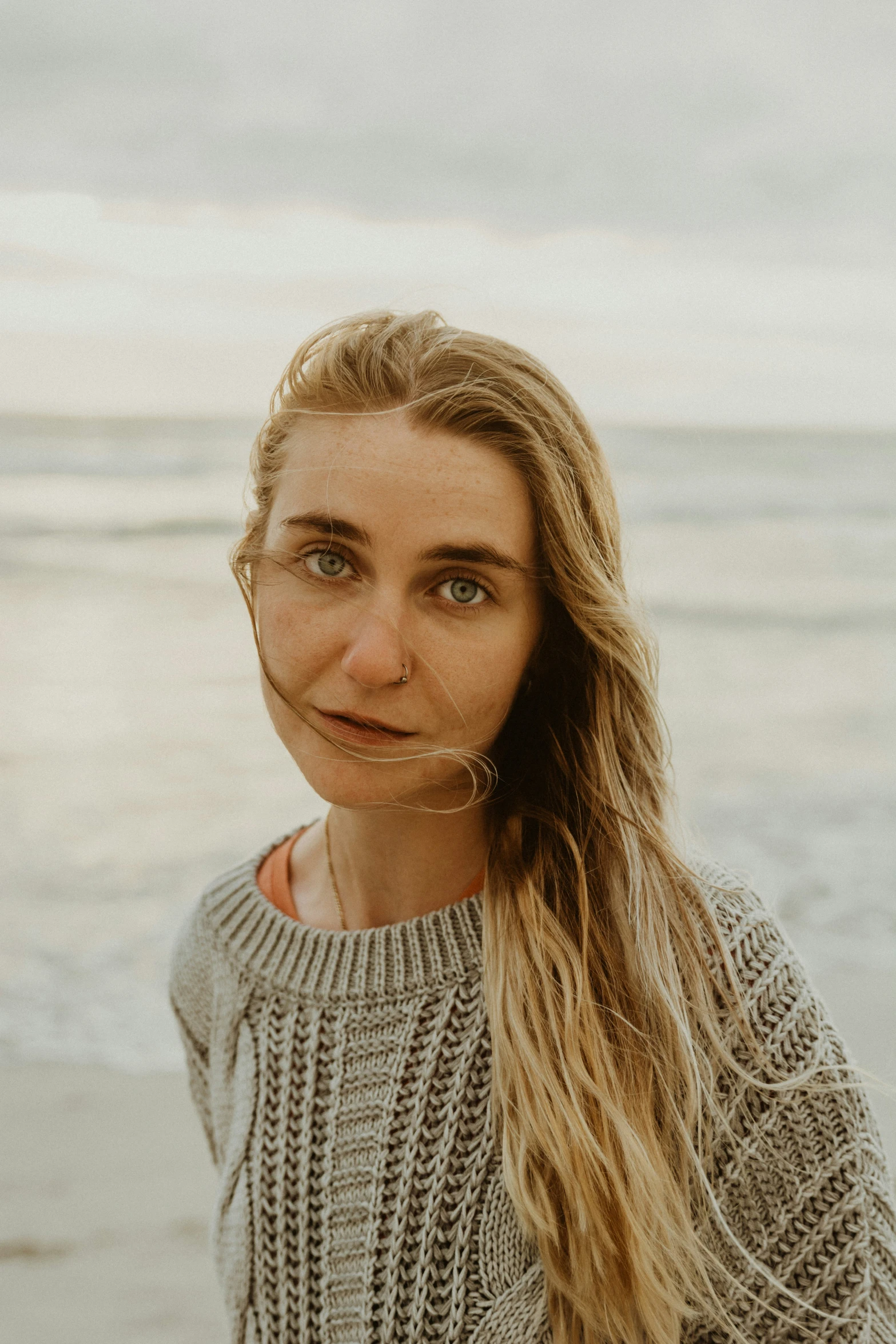 a beautiful blonde woman looking at the camera