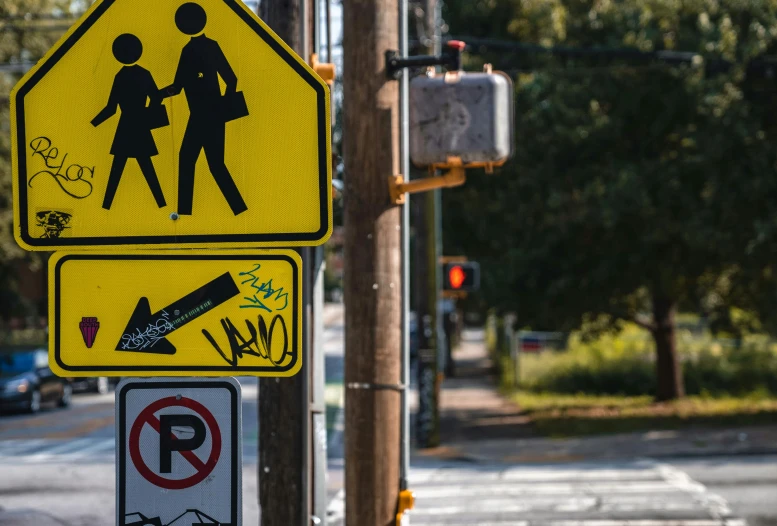 a street sign depicting a couple walking beside a no parking sign