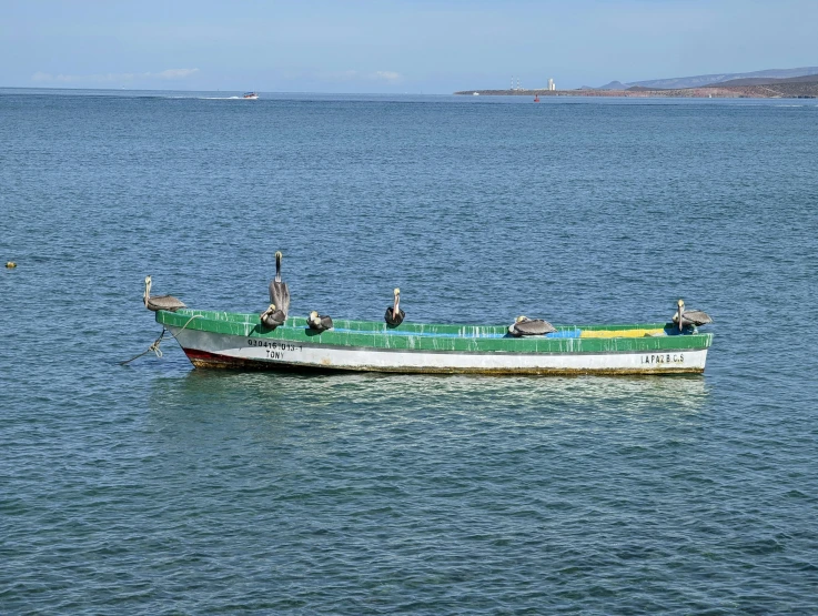 a boat floating in the middle of a lake