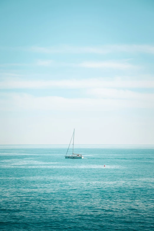 a boat is sailing out on the open ocean