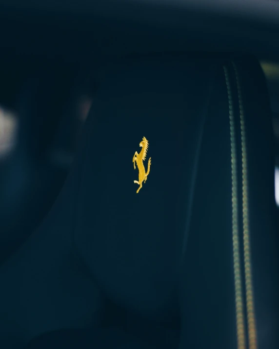 the small emblem on the seat of a car