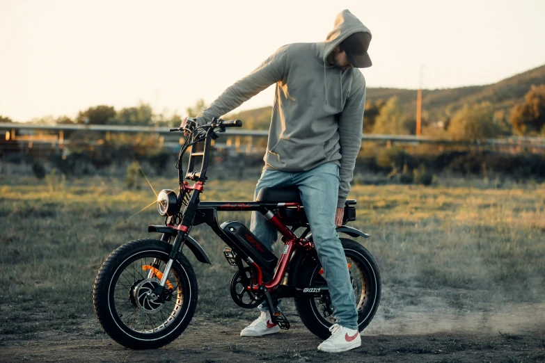 a person sitting on top of a bike