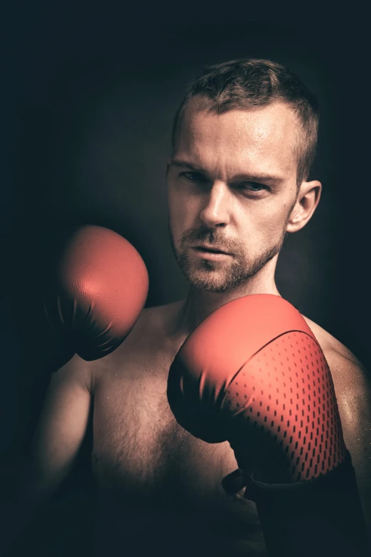 a man with  wearing boxing gloves