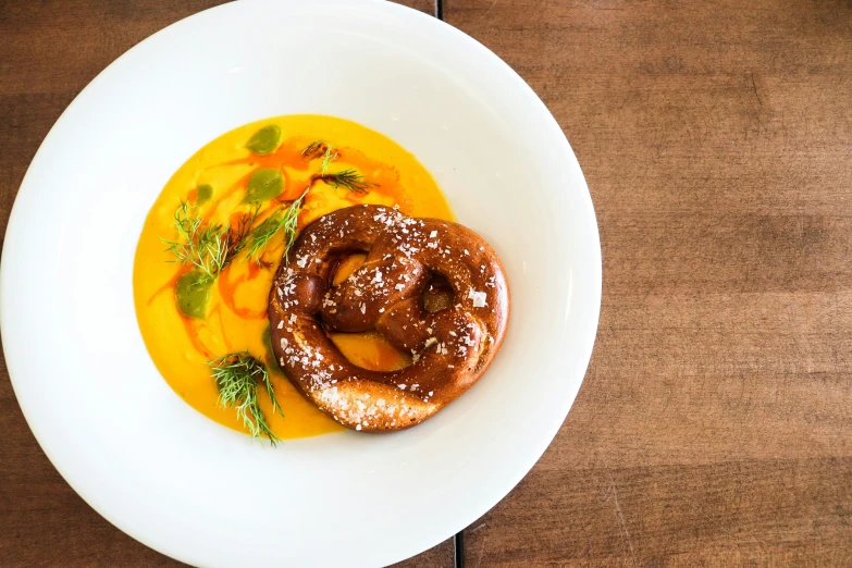 two baked donuts on top of a white plate