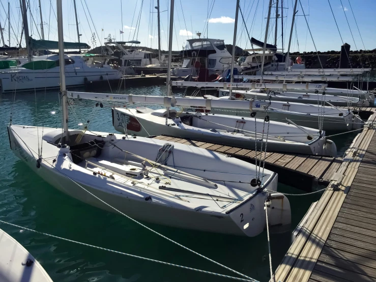 a large body of water with several boats docked at a dock