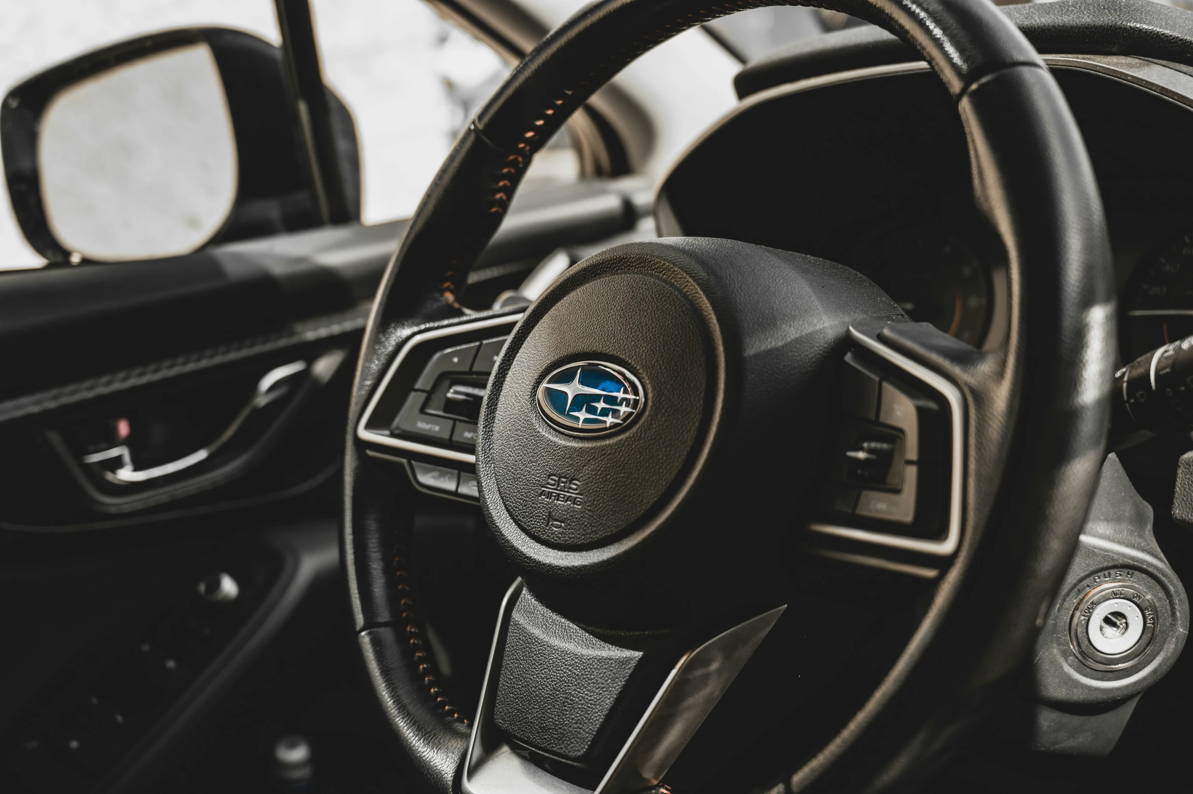 a dashboard in an automobile parked in a driveway