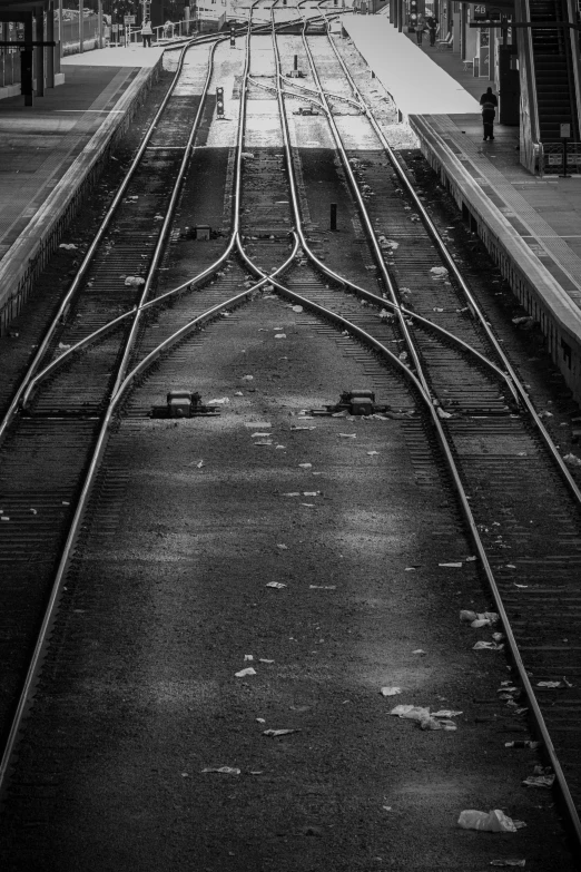 a view of a city at a train station with two people