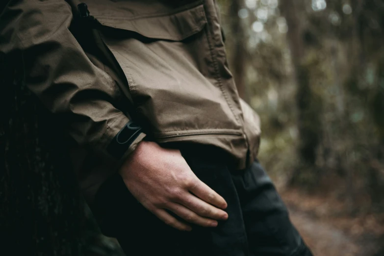 a person holding their hands on a tree