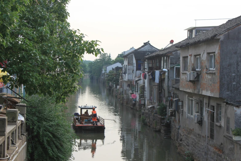 an old city with canal and boats on it