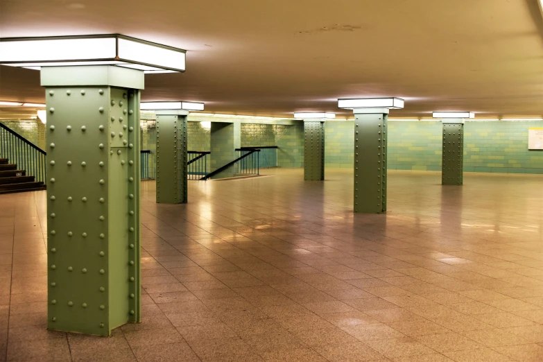 a dimly lit parking garage with large columns