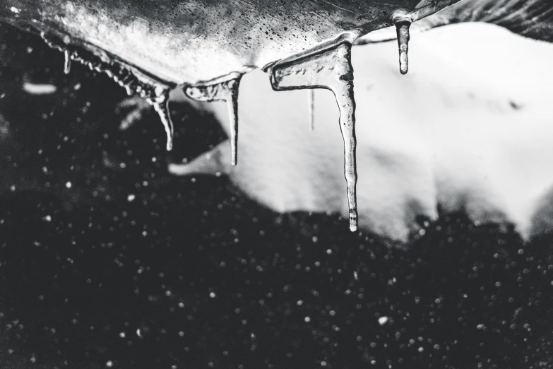 some ice covered objects in the snow and water