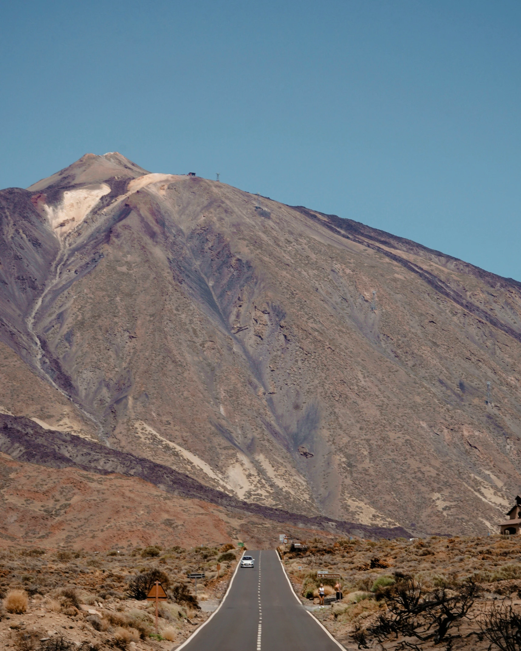 the bus is traveling down the desert road