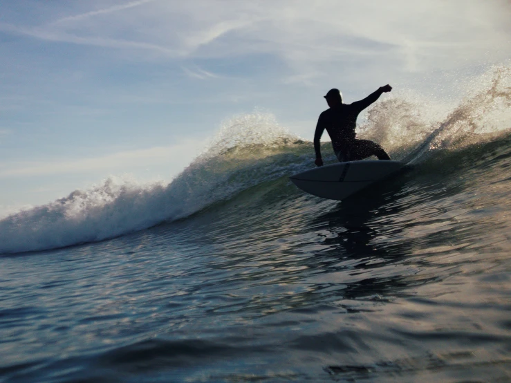 the surfer is on his board about to catch a wave