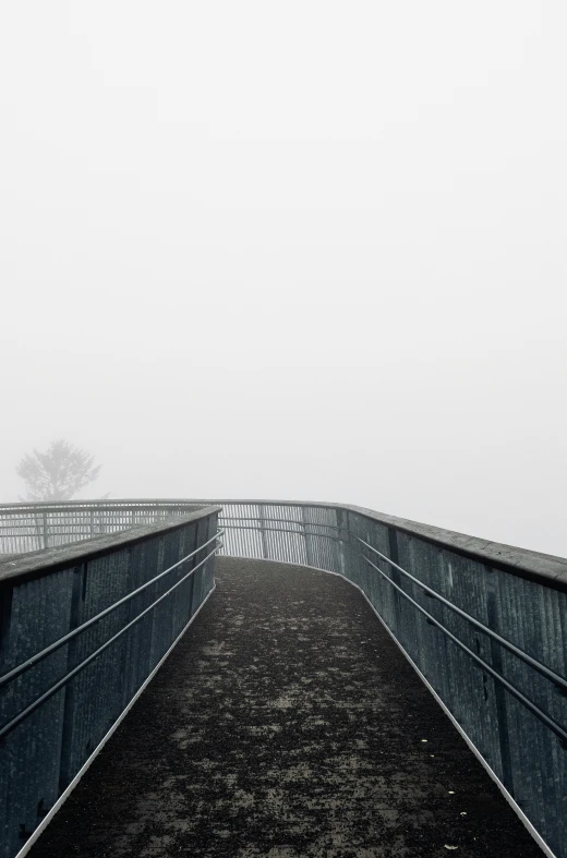 a walkway that is very dark and wet