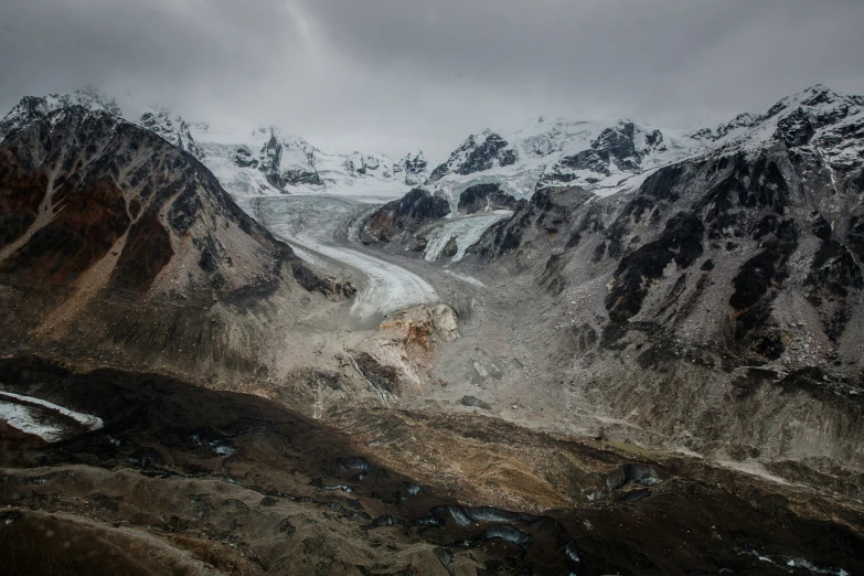 some mountain side and clouds and mountains