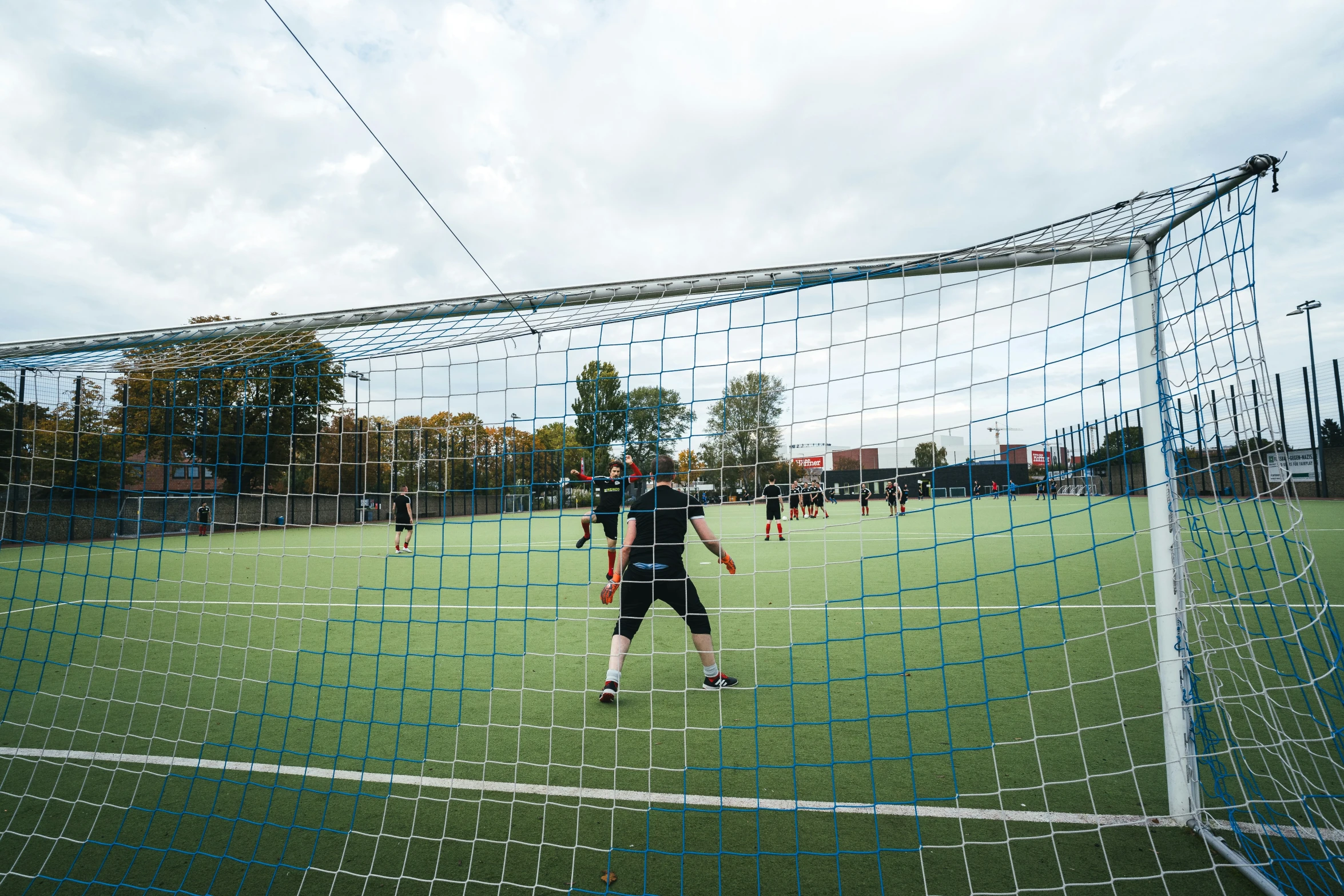 an image of a soccer goalie preparing for the ball